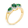 Thumbnail Image 1 of Oval and Pear-Shaped Lab-Created Emerald and 0.14 CT. T.W. Diamond Frame Three Stone Ring in 10K Gold