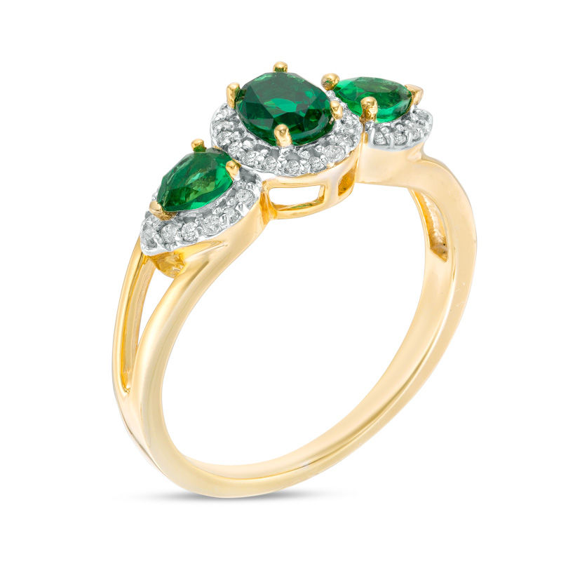 Oval and Pear-Shaped Lab-Created Emerald and 0.14 CT. T.W. Diamond Frame Three Stone Ring in 10K Gold