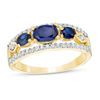 Thumbnail Image 0 of Sideways Oval Lab-Created Blue Sapphire and 0.23 CT. T.W. Diamond Three Stone Ring in 10K Gold