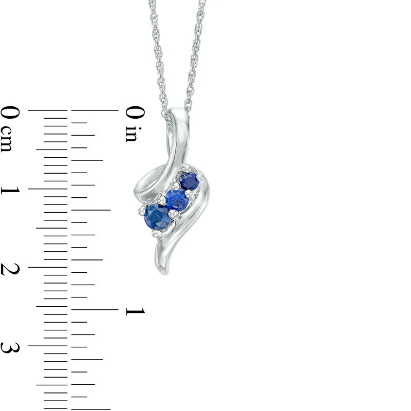 Graduated Lab-Created Blue Sapphire Beaded Swirl Ribbon Three Stone Pendant in Sterling Silver