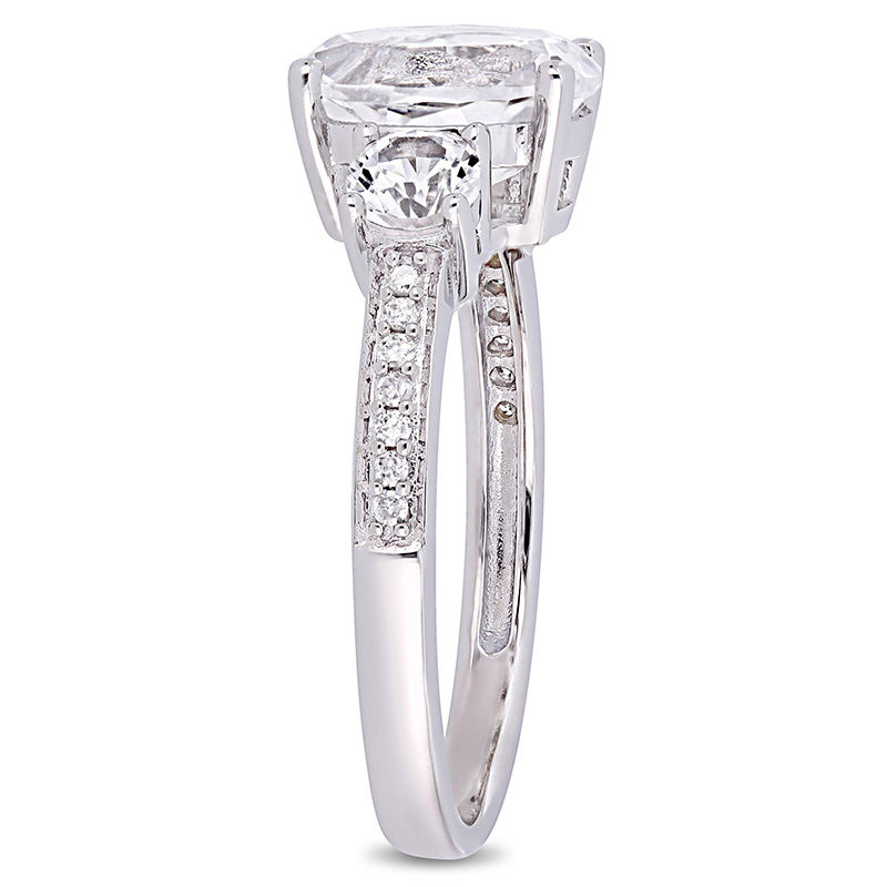Oval Lab-Created White Sapphire and 0.07 CT. T.W. Diamond Three Stone Engagement Ring in 10K White Gold