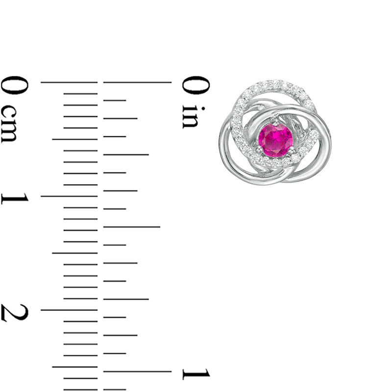 Main Image 2 of 3.0mm Lab-Created Ruby and 0.116 CT. T.W. Diamond Love Knot Frame Stud Earrings in Sterling Silver