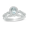Thumbnail Image 0 of Oval Aquamarine and 0.21 CT. T.W. Diamond Frame Vintage-Style Bridal Set in 10K White Gold