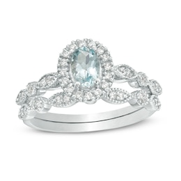 Oval Aquamarine and 0.21 CT. T.W. Diamond Frame Vintage-Style Bridal Set in 10K White Gold