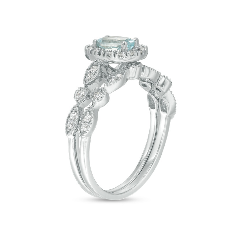 Oval Aquamarine and 0.21 CT. T.W. Diamond Frame Vintage-Style Bridal Set in 10K White Gold