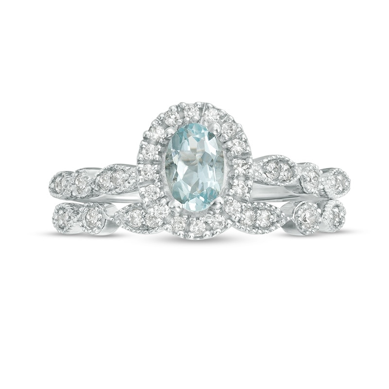 Oval Aquamarine and 0.21 CT. T.W. Diamond Frame Vintage-Style Bridal Set in 10K White Gold