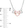 0.085 CT. T.W. Diamond Infinity Heart Interlocking Necklace in Sterling Silver and 10K Rose Gold - 17.38"