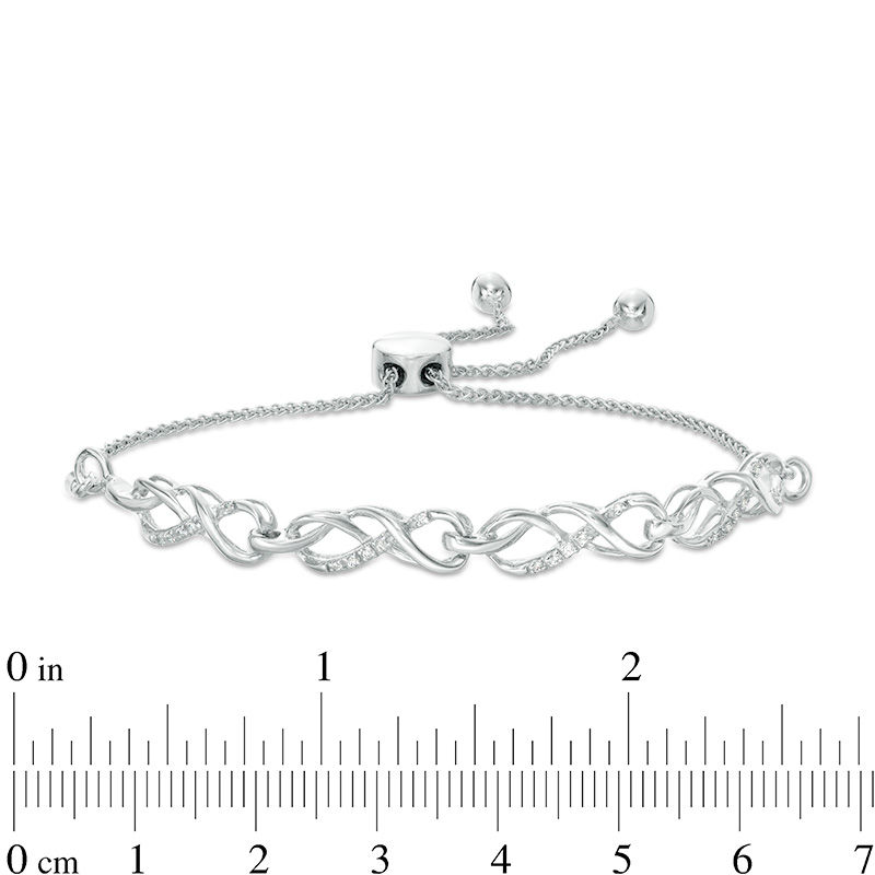 0.065 CT. T.W. Diamond Infinity Knot Bolo Bracelet in Sterling Silver - 9.5"