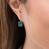 Thumbnail Image 1 of Emerald-Cut London Blue Topaz and 0.04 CT. T.W. Diamond Drop Earrings in 10K Gold