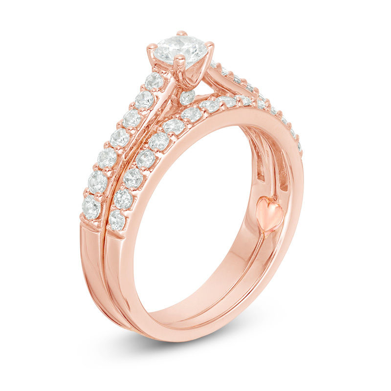 Perfect Fit 0.50 CT. T.W. Baguette and Round Diamond Frame Interlocking Bridal Set in 14K Rose Gold