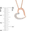 0.04 CT. T.W. Diamond Tilted Heart Pendant in 10K Rose Gold