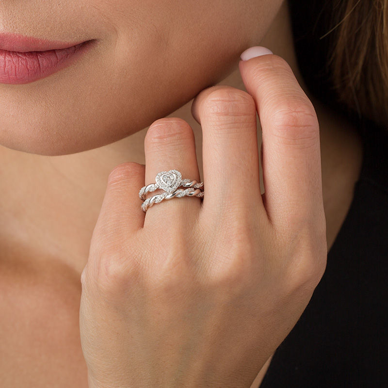 Peoples 0.22 CT. T.w. Diamond Heart Shape Frame Twist Bridal Set in 10K White