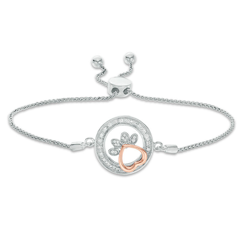 0.065 CT. T.W. Diamond Open Circle Paw Print Bolo Bracelet in Sterling Silver and 10K Rose Gold - 9.5"