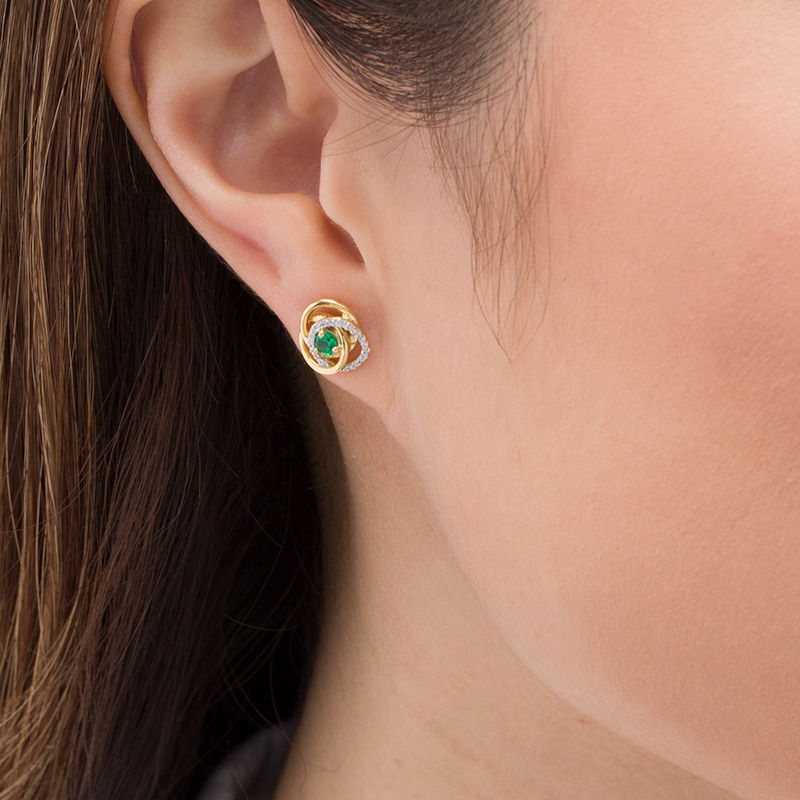 Main Image 2 of 3.0mm Emerald and 0.07 CT. T.W. Diamond Love Knot Frame Stud Earrings in 10K Gold