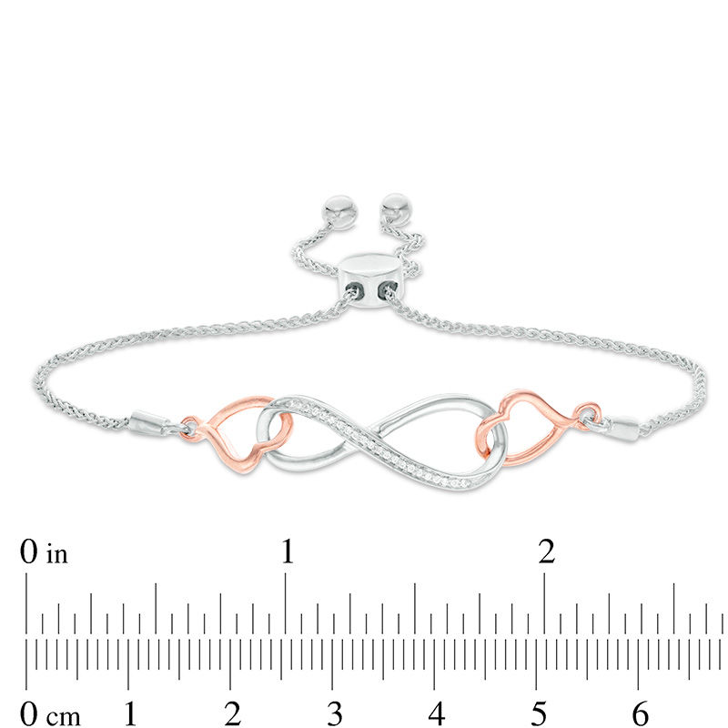 0.04 CT. T.W. Diamond Interlocking Sideways Heart and Infinity Bolo Bracelet in Sterling Silver and 10K Rose Gold - 9.5"|Peoples Jewellers