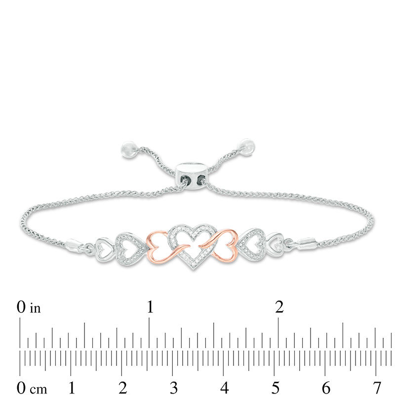 0.04 CT. T.W. Diamond Intertwining Sideways Heart Bolo Bracelet in Sterling Silver and 10K Rose Gold - 9.5"