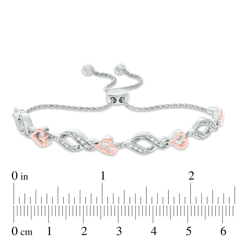0.04 CT. T.W. Diamond Sideways Heart and Flame Link Bolo Bracelet in Sterling Silver and 10K Rose Gold - 9.5"