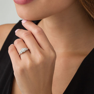 0.45 CT. T.W. Diamond Three Stone Frame X-Sides Engagement Ring in 10K White Gold