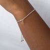 Thumbnail Image 2 of Peoples 100-Year Anniversary 0.18 CT. T.W. Diamond Inukshuk Bolo Bracelet in Sterling Silver and 14K Gold - 9.5"
