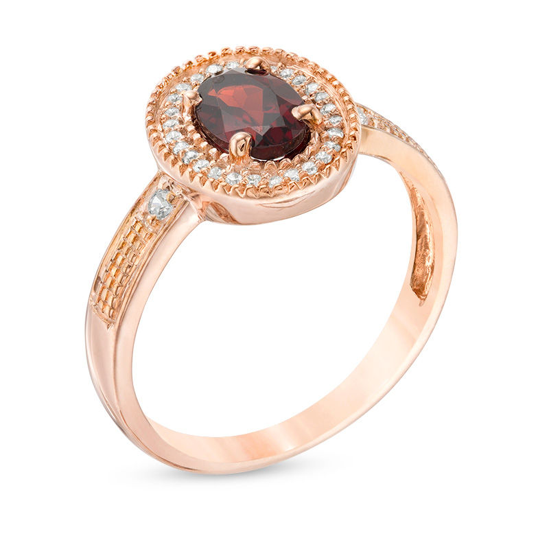 Oval Garnet and 0.085 CT. T.W. Diamond Frame Vintage-Style Ring in 10K Rose Gold