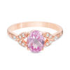 Thumbnail Image 0 of Oval Lab-Created Pink Sapphire and 0.086 CT. T.W. Diamond Leaf Sides Ring in 10K Rose Gold