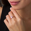 Thumbnail Image 1 of Oval Lab-Created Pink Sapphire and 0.086 CT. T.W. Diamond Leaf Sides Ring in 10K Rose Gold