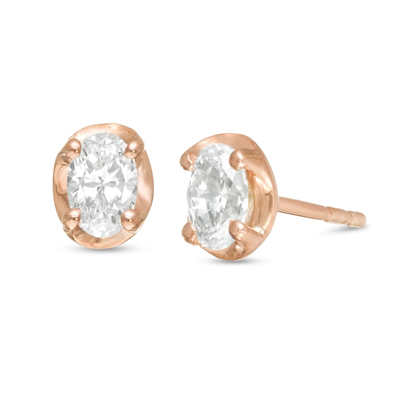 Main Image 1 of 0.45 CT. T. W. Oval Diamond Solitaire Stud Earrings in 10K Rose Gold