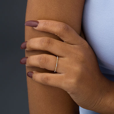 0.05 CT. T.W. Diamond and Beaded Station Anniversary Band in 10K Gold
