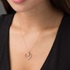Thumbnail Image 1 of Lab-Created White Sapphire and 0.07 CT. T.W. Diamond Looping Heart Pendant in 10K Rose Gold