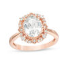 Thumbnail Image 1 of Oval Lab-Created White Sapphire and 0.148 CT. T.W. Diamond Frame Vintage-Style Ring in 10K Rose Gold