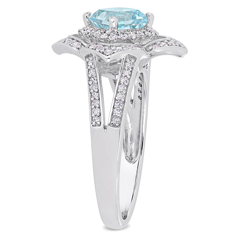 6.0mm Cushion-Cut Blue Topaz and 0.19 CT. T.W. Diamond Flower Frame Split Shank Ring in Sterling Silver