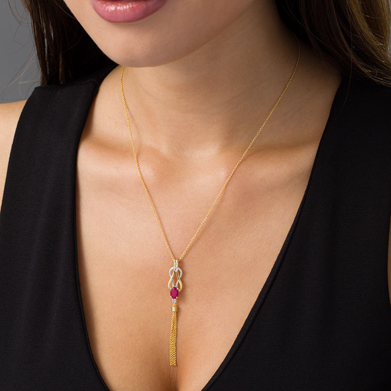 Oval Lab-Created Ruby and 0.04 CT. T.W. Diamond Double Loop Knot Tassel Pendant in Sterling Silver with 14K Gold Plate