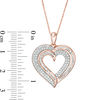0.45 CT. T.W. Baguette and Round Diamond Heart Pendant in 10K Rose Gold