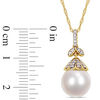 10.0-11.0mm Oval South Sea Cultured Pearl and 0.097 CT. T.W. Diamond Flower Top Pendant in 14K Gold-17"