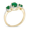 Thumbnail Image 1 of Oval Emerald and 0.04 CT. T.W. Diamond Three Stone Frame Ring in 10K Gold