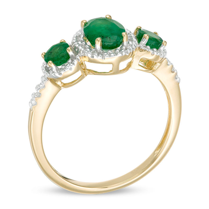 Oval Emerald and 0.04 CT. T.W. Diamond Three Stone Frame Ring in 10K Gold