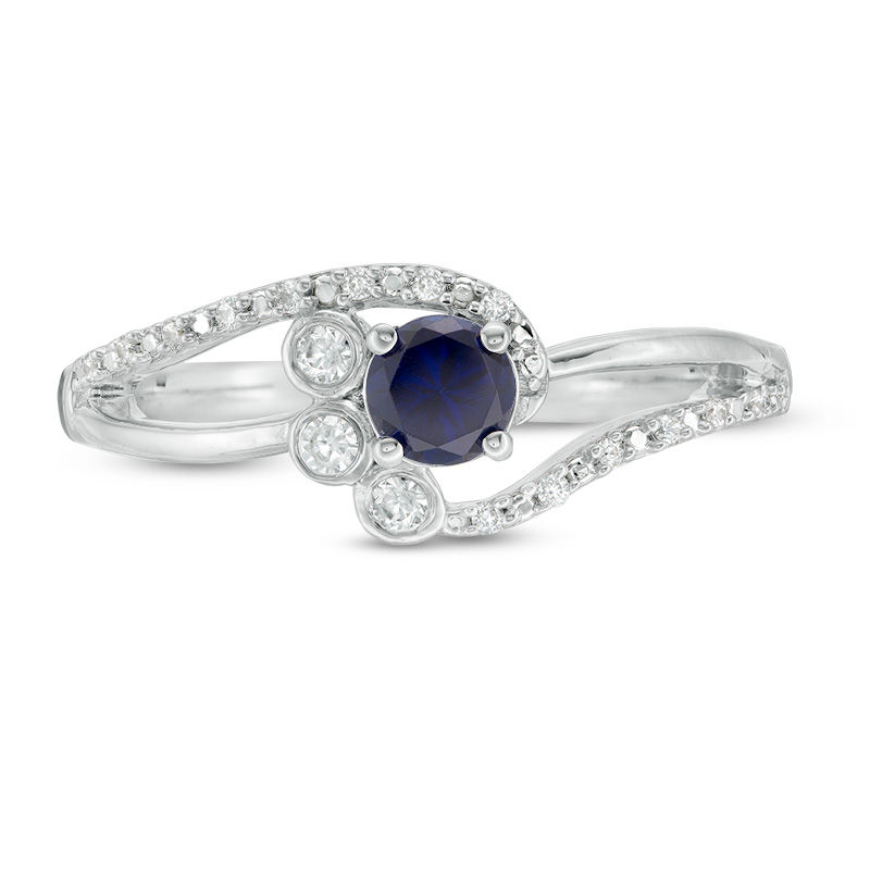 4.0mm Lab-Created Blue Sapphire and 0.065 CT. T.W. Diamond Bezel-Set Side Accent Bypass Promise Ring in Sterling Silver
