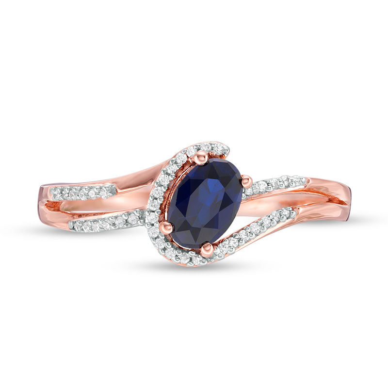 Main Image 4 of Oval Lab-Created Blue Sapphire and 0.065 CT. T.W. Diamond Swirling Bypass Split Shank Promise Ring in 10K Rose Gold