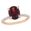 Thumbnail Image 0 of Oval Garnet and 0.10 CT. T.W. Diamond Engagement Ring in 10K Rose Gold