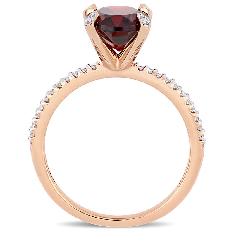 Oval Garnet and 0.10 CT. T.W. Diamond Engagement Ring in 10K Rose Gold