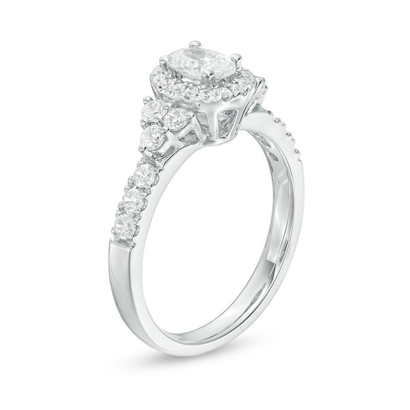 Adrianna Papell 0.95 CT. T.W. Certified Oval Diamond Frame Tri-Sides Engagement Ring in 14K White Gold (F/I1)