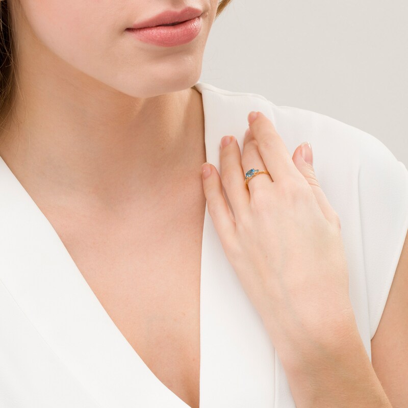 Main Image 2 of Sideways Oval Blue Topaz and Diamond Accent Ring in 10K Gold