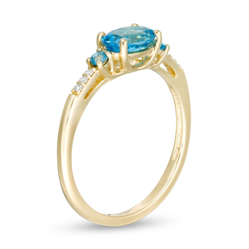 Sideways Oval Blue Topaz and Diamond Accent Ring in 10K Gold