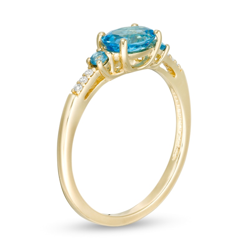 Main Image 3 of Sideways Oval Blue Topaz and Diamond Accent Ring in 10K Gold