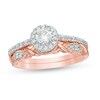 Thumbnail Image 1 of 0.58 CT. T.W. Diamond Frame Twist Shank Bridal Set in 10K Rose Gold