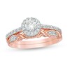 Thumbnail Image 0 of 0.58 CT. T.W. Diamond Frame Twist Shank Bridal Set in 10K Rose Gold