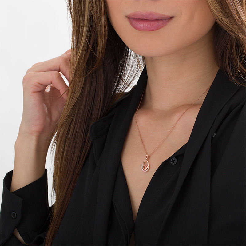 0.086 CT. T.W. Diamond Infinity Heart Pendant in 10K Rose Gold