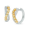 Thumbnail Image 1 of 0.18 CT. T.W. Diamond Bezel-Set Crossover Hoop Earrings in 10K Two-Tone Gold