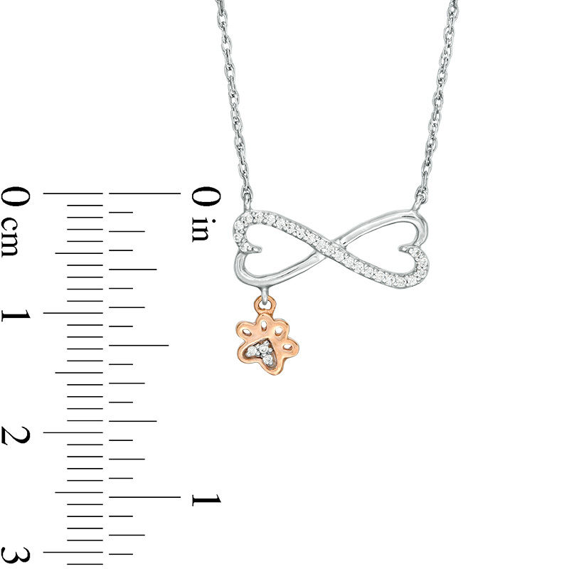 0.067 CT. T.W. Diamond Sideways Heart Infinity with Paw Print Dangle Necklace in Sterling Silver and 10K Rose Gold