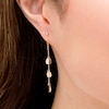 Thumbnail Image 1 of Flower Petal Station Chain Drop Earrings in 14K Gold